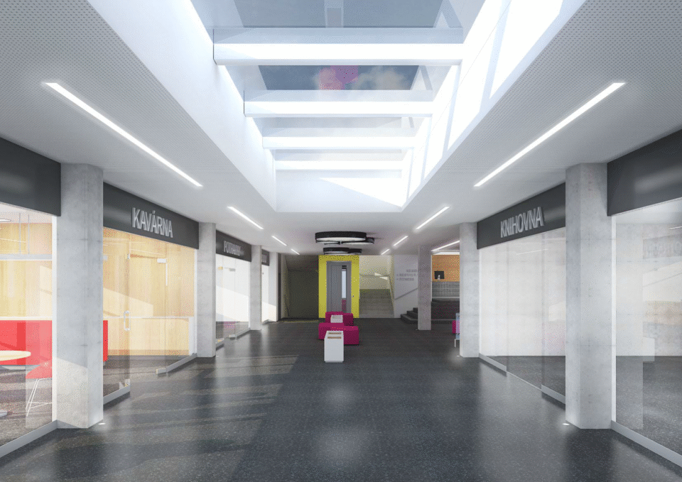 Moderní interiér obchodního centra s proskleným stropem a čistými liniemi světlá hala nabízí pohodlné nakupování a příjemné prostředí pro návštěvníky.