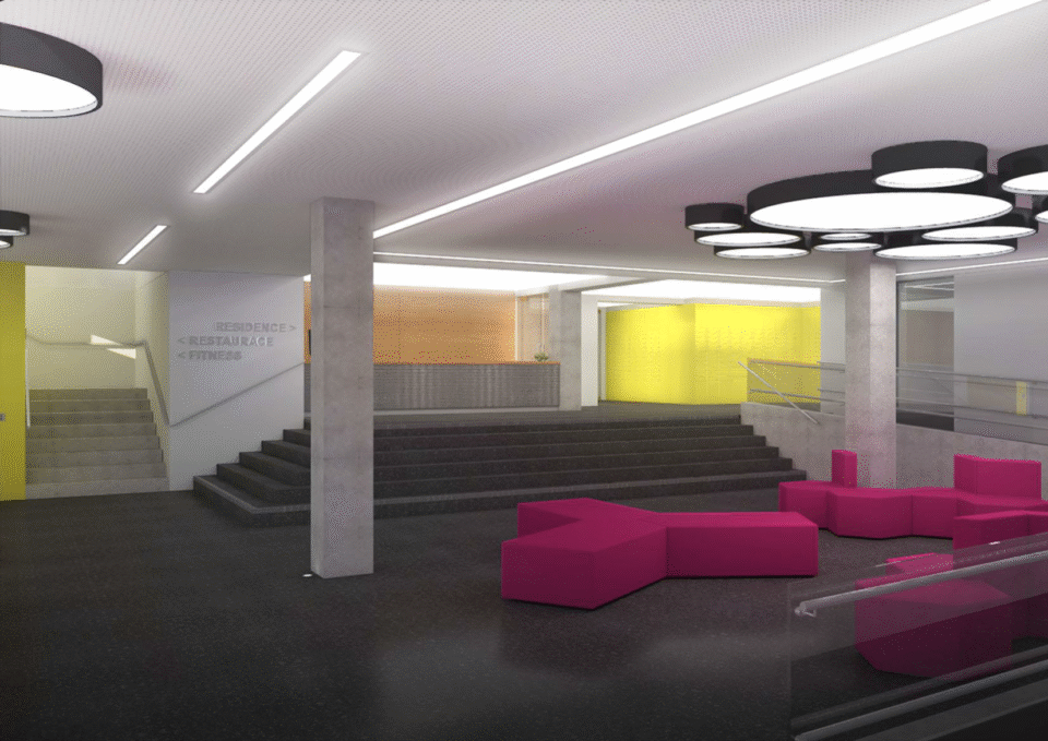 Moderní interiér kancelářské budovy s jasným osvětlením a barevným nábytkem v otevřeném prostoru. Designová svítidla a moderní architektura vytvářejí stylové prostředí.